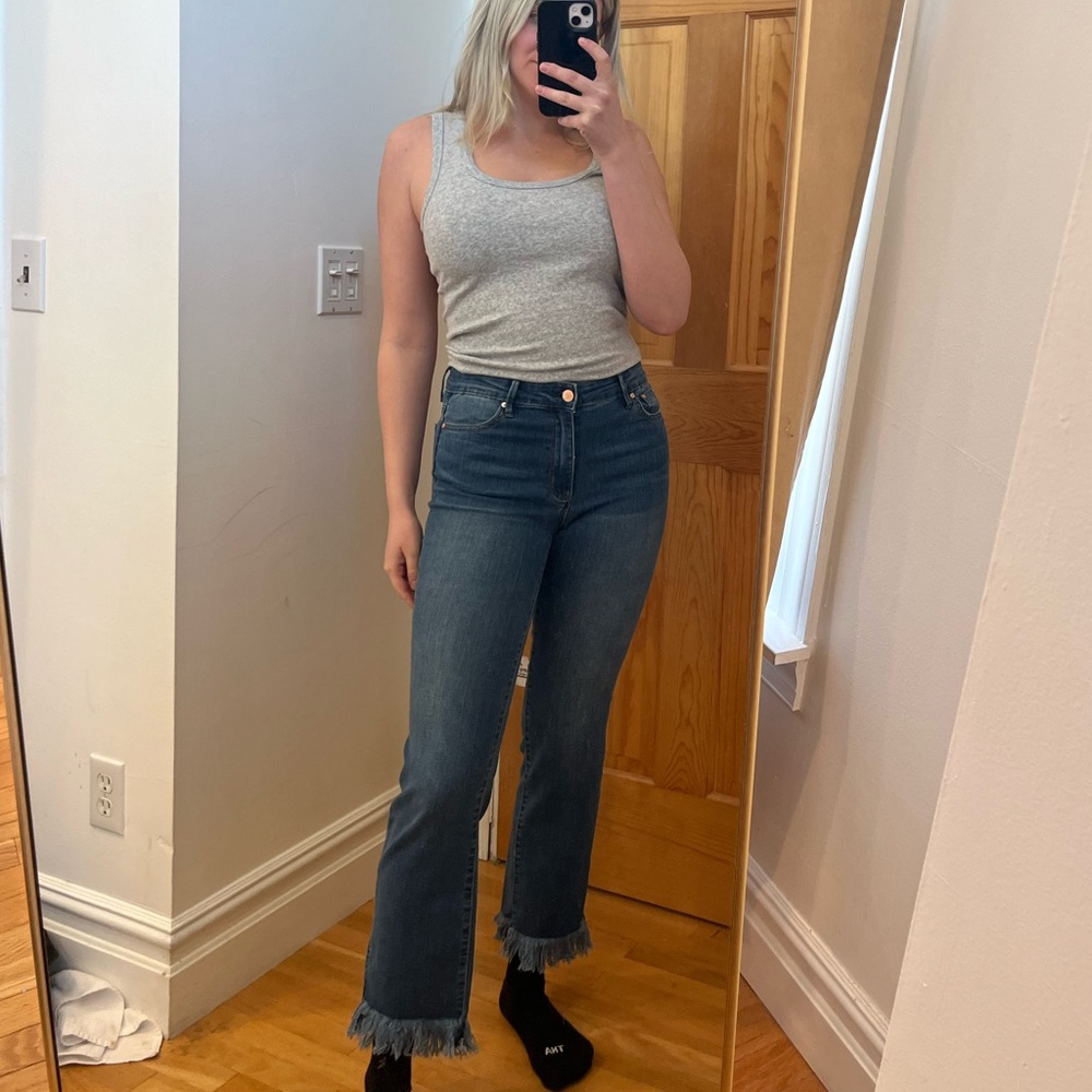 Stylish bootcut jeans with fringe detail on the bottom